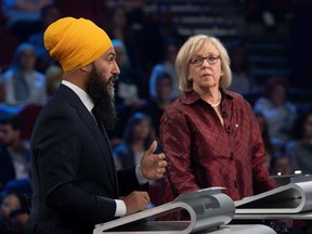 NDP leader Jagmeet Singh (L) and Green Party leader Elizabeth May take part in the Federal leaders French language debate at the Canadian Museum of History in Gatineau, Quebec on October 10, 2019.