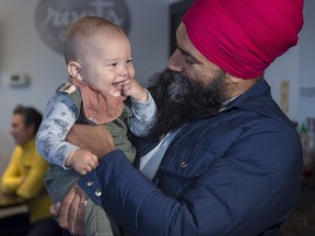 NDP Leader Jagmeet Singh hold seven-month-old Alder Tull-Best at a campaign stop in Vancouver on Tuesday, Oct. 1, 2019.