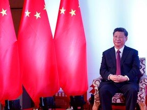 In this handout photograph released by the The Rising Nepal newspaper and taken on October 13, 2019, China's President Xi Jinping looks on as he attends a bilateral meeting in Kathmandu.