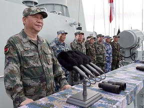 Chinese President Xi Jinping reviews the Chinese fleet in the South China Sea in a file photo from April 12, 2018.