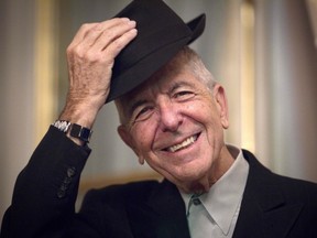 This file photo taken on January 16, 2012 shows Canadian singer and poet Leonard Cohen taking off his hat to salute in Paris.