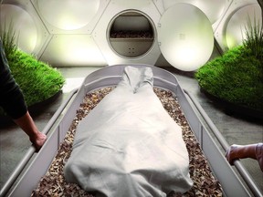 A body being placed into a Recompose vessel in Olson Kundig's facility, to be turned into soil.

Courtesy: Olson Kundig