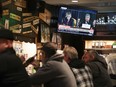 Live testimony of the House impeachment hearings against President Donald Trump is shown on a television at the Billy Goat Tavern on November 13, 2019 in Chicago, Illinois.