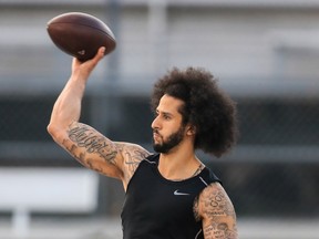 Colin Kaepernick makes a pass during a private NFL workout held at Charles R Drew high school on November 16, 2019 in Riverdale, Georgia.