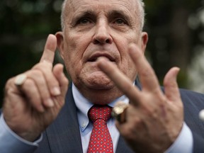 Rudy Giuliani, former New York City mayor and current lawyer for U.S. President Donald Trump, speaks to members of the media during a White House Sports and Fitness Day at the South Lawn of the White House May 30, 2018 in Washington, DC.