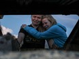 Members of the Lebaron family mourn while they watch the burned car where part of the nine murdered members of the family were killed and burned during an gunmen ambush on Bavispe, Sonora mountains, Mexico, on November 5, 2019.