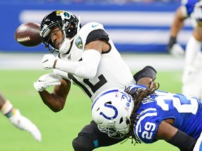 Nov 17, 2019, Indianapolis: Jacksonville Jaguars receiver Dede Westbrook (12) drops a pass after being hit by Indianapolis Colts safety Malik Hooker (29) in the second half  at Lucas Oil Stadium.