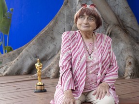 Director Agnes Varda poses with her Academy of Motion Picture Arts And Sciences' 9th Annual Governors Awards Honorary Award Statue during a brunch celebrating her career organized by the French Consulate in Los Angeles at La Residence de France on November 12, 2017 in Beverly Hills, California.
