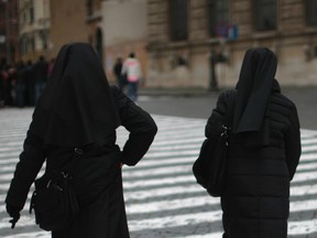 Nuns walk through Vatican City near St. Peter's Square on February 25, 2013 in Rome, Italy.