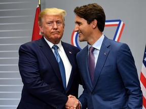 U.S. President Donald Trump shakes hands with Prime Minister Justin Trudeau during a bilateral meeting in Biarritz, France on Aug. 25, 2019.
