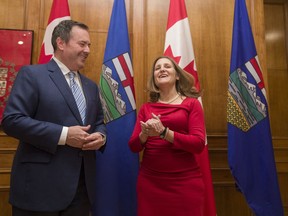 Deputy Prime Minister Chrystia Freeland and Alberta Premier Jason Kenney take part in a photo opportunity ahead of their meeting in Edmonton on Monday, November 25, 2019.