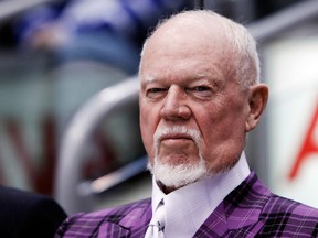 Hockey commentator Don Cherry wearing one of his trademark high collared-shirts and ostentatious suits.