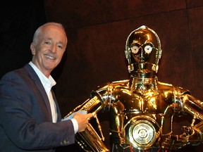 Anthony Daniels next to his Star Wars counterpart, C-3PO.