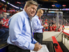 Calgary Flames head coach Bill Peters, foreground, during a game on Nov. 7, 2019.