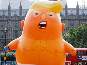The 'Trump Baby' blimp, a six meter-high helium-filled effigy of U.S. President Donald Trump, lifts off from Parliament Square in London, U.K., on Friday, July 13, 2018.
