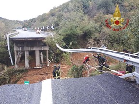 A portion of a motorway bridge linking Savona to Turin is seen after it collapsed due to a landslide near Savona, Italy, November 24, 2019.