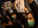 Anti-government protesters gather in front of the Hong Kong Polytechnic University where a small number of protesters are held up inside on Nov. 25, 2019 in Hong Kong, China.