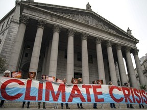 Environmental activists rally for accountability for fossil fuel companies outside of New York Supreme Court on October 22, 2019 in New York City.