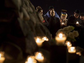 Some University of Alberta students are calling on the school to fire an assistant lecturer who denies the Holodomor, the mass genocide against Ukrainian people carried out by the Soviet Union in the 1930s. People light candles to mark a day of memory for the victims of the Holodomor in 1932-1933 at the former KGB building in Vilnius, Lithuania, Friday, Nov. 25, 2016.