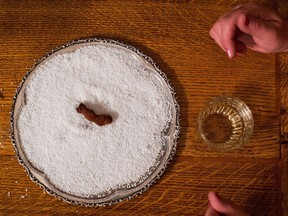 A dehydrated human toe that is used in the Sourtoe Cocktail rests on a bed of salt at the Downtown Hotel, before being dropped in a shot of whisky for a customer, in Dawson City, Yukon, in Dawson City, Yukon, on Sunday, July 1, 2018. The founder of the legendary Sourtoe Cocktail, a shot of Yukon whisky poured over a pickled human big toe, has poured his last drink. Dick Stevenson, the former Dawson City, Yukon bartender known worldwide as Captain Dick, has died. He was 89.