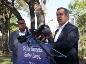 Spruce Woods Progressive Conservative candidate Cliff Cullen speaks during an announcement outside the Health Sciences Centre, in Winnipeg on Thursday, Aug. 22, 2019. The Manitoba government is promising new efforts to stem a rising tide of liquor store robberies.