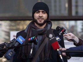 Omar Khadr speaks outside court in Edmonton on December 13, 2018. A military court is refusing to lift a stay of Omar Khadr's appeal of his convictions in Guantanamo Bay. His Edmonton lawyer, Nate Whitling, says today's order by the United States Court of Military Commission Review could mean years of additional delay for his client.