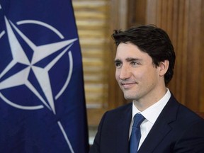 Prime Minister Justin Trudeau meets with NATO Secretary General Jens Stoltenberg in his office on Parliament Hill in Ottawa on Wednesday, April 4, 2018. Canadian military spending is expected to remain stagnant this year despite calls for more from the U.S. That is likely to set up some tough talks for Prime Minister Justin Trudeau when he meets other leaders from the NATO military alliance in London next week.