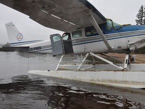 The wreckage of a Cessna 206 float plane is shown at Little Doctor Lake, N.W.T., in this 2018 handout photo. The Transportation Safety Board is confirming that a design problem in a popular small airplane contributed to three deaths in a 2018 crash in the Northwest Territories.