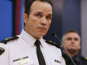 The chief of the Winnipeg Police Service says he may have to cut staff due to a budget shortfall amid a spike in violence and property crimes. Winnipeg Police Superintendent Danny Smyth speaks at a press conference in Winnipeg, Wednesday, Nov. 12, 2014.