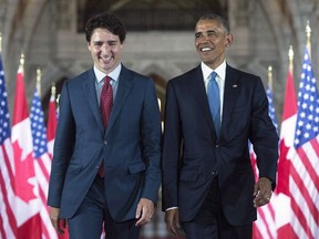 U.S. President Barack Obama and Prime Minister Justin Trudeau walk down the Hall of Honour on Parliament Hill, in Ottawa, June 29, 2016.