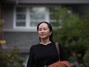 Huawei chief financial officer Meng Wanzhou leaves her home to attend a court hearing in Vancouver on Wednesday October 2, 2019. Lawyers Wanzhou say the United States is "dressing up" its complaint that she violated sanctions as a case of fraud and have asked the B.C. Supreme Court to decline her extradition.