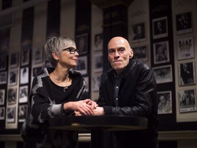 Jill Daum and her husband John Mann, lead singer of Spirit of the West, pose for a photograph in Toronto on Friday, April 29, 2016. Mann, who was diagnosed with Alzheimer's disease at the age of 52, died Wednesday.
