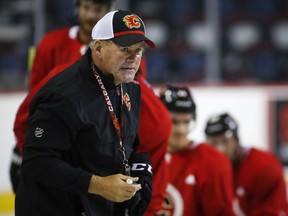 Calgary Flames head coach Bill Peters gives instruction during training camp in Calgary, Friday, Sept. 13, 2019. The Flames will practise in Calgary Friday morning for the first time since allegations surfaced earlier this week that head coach Bill Peters used a racial slur against a former player 10 years ago.