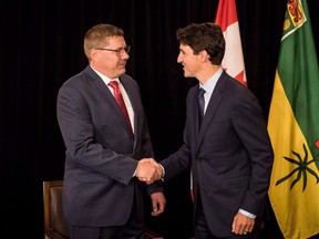 Prime Minister Justin Trudeau, right, meets with Saskatchewan Premier Scott Moe in Saskatoon, Sask., on September 12, 2018. Saskatchewan Premier Scott Moe has three things on his wish list that he'd like to discuss with Prime Minister Justin Trudeau in a meeting set for Tuesday in Ottawa.