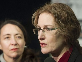 Polytechnique survivors Heidi Rathjen, right, and Nathalie Provost speak to the media following an announcement of details of Quebec's long gun registry by Quebec Public Security Minister Martin Coiteux during a news conference in Montreal, Sunday, January 28, 2018. A leading voice for stricter gun control is calling on the Liberal government to place an immediate moratorium on new sales of assault-style firearms as well as a permanent ban on the importation and manufacture of handguns.
