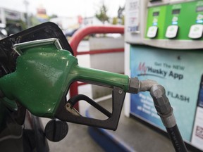 A car is fuelled up at a gas station in Vancouver, Wednesday, July 17, 2019. An independent economic think tank says raising Canada's national carbon price to $210 by 2030 would be the easiest and most cost-effective way for Canada to meet its climate targets.