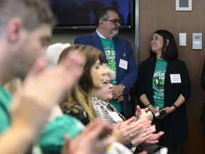 Toby and Bernadine Boulet look at one another as they are recognized during an event for Green Shirt Day and National Organ and Tissue Donation Awareness Week in Ottawa on April 3, 2019. The father of a young hockey player who donated his organs after dying in a catastrophic bus crash says a new bill before the Alberta legislature addressing the issue is a good start but has a long way to go. "(It's) a great start," said Toby Boulet. "In Alberta we need to do better." Six people benefitted from organs harvested from the body of Boulet's son Logan, a member of the SJHL's Humboldt Broncos who was among 16 killed when the team's bus collided with a truck in 2018.