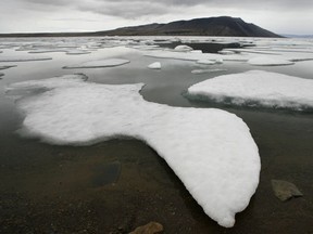 Ice floats in Slidre Fjord outside the Eureka Weather Station, on Ellesmere Island, Nunavut, Monday, July 24, 2006.