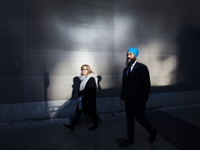 NDP Leader Jagmeet Singh walks down the street greeting people after the Canadian federal election in Burnaby, B.C., Tuesday, Oct. 22, 2019.