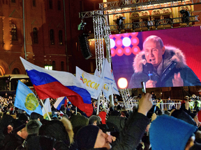 President Vladimir Putin speaks during a rally to celebrate the fourth anniversary of Russia's annexation of Crimea, in Moscow on March 18, 2018.