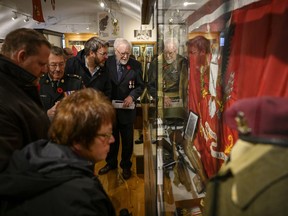 Family and friends of the late Second World War Sergeant Herb Peppard join other members of the military for the unveiling of a new First Special Service Force exhibit featuring Sergeant Peppard's memorabilia at the Army Museum Halifax Citadel in Halifax on Friday, November 8, 2019.