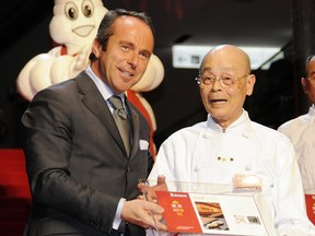Michelin director Jean-Luc Naret, left, is pictured with sushi chef Jiro Ono
