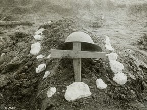 The makeshift grave of a Canadian soldier, buried on the battlefield at Vimy Ridge by his comrades, is seen in a First World War photograph from April 1917.