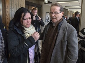 Glen Assoun stands with his daughter Amanda Huckle at Nova Scotia Supreme Court in Halifax on Friday, March 1, 2019. As she was fitted for a crisp new uniform in 2017, Amanda Assoun thought her lifelong dream of becoming a Halifax police officer was coming true. But five days later, a one-line note confirmed for her that there was no escaping her last name.