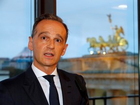 German Foreign Minister Heiko Maas speaks at a ceremony marking the 30th anniversary of the fall of the Berlin Wall with the Quadriga of the Brandenburg Gate in the background, in Berlin, Germany November 9, 2019.