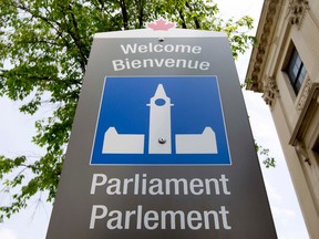 Bilingual sign of a Parliament Hill sign, in Ottawa , June 18, 2012.