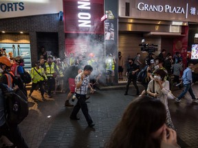 Riot police shoot pepper balls to residents in Mongkok district on November 10, 2019 in Hong Kong, China.