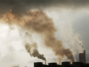 A chemical factory discharges exhaust into the air of Mumbai, India.