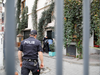 Turkish police officers stand outisde the home office of James Le Mesurier, founder of the Mayday Rescue group, in Istanbul, Turkey, Nov. 1, 2019.