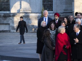 Prime Minister Justin Trudeau walks towards his cabinet to speak to reporters following a swearing in ceremony at Rideau Hall in Ottawa, on Wednesday, Nov. 20, 2019.